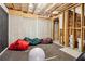 Unfinished basement with exposed ceiling, concrete walls, and various storage items at 2452 Stone Manor Ne Dr, Buford, GA 30519