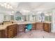 Bathroom features granite countertops, wood cabinetry, double sinks, mirrors, and great lighting at 2452 Stone Manor Ne Dr, Buford, GA 30519