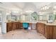 Large bathroom with granite countertops, wooden cabinets, double sinks, and a jacuzzi tub at 2452 Stone Manor Ne Dr, Buford, GA 30519