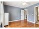 Empty bedroom featuring hardwood floors and a neutral paint color at 2452 Stone Manor Ne Dr, Buford, GA 30519