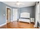 Bedroom with a decorative bed frame and large window providing natural light at 2452 Stone Manor Ne Dr, Buford, GA 30519