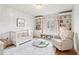 Charming Bedroom with natural light, built-in bookcases, crib and a comfy chair at 2452 Stone Manor Ne Dr, Buford, GA 30519