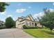 This home includes three-car garage and an elongated driveway at 2452 Stone Manor Ne Dr, Buford, GA 30519