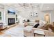 Spacious living room with fireplace, coffered ceiling, and hardwood floors at 2452 Stone Manor Ne Dr, Buford, GA 30519