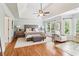 Spacious main bedroom with hardwood floors, trey ceiling and a sitting area at 2452 Stone Manor Ne Dr, Buford, GA 30519