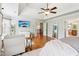 Bright and sunny main bedroom with hardwood floors, a tray ceiling, and lots of closet space at 2452 Stone Manor Ne Dr, Buford, GA 30519