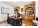 Office space with built-in bookcases, hardwood flooring, and custom details at 2452 Stone Manor Ne Dr, Buford, GA 30519