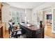 Office with bright windows and door, desk and hardwood flooring at 2452 Stone Manor Ne Dr, Buford, GA 30519
