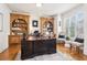 Spacious office with custom built-in shelves and ample natural light at 2452 Stone Manor Ne Dr, Buford, GA 30519