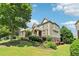 Brick home with stone archway and manicured landscaping at 2452 Stone Manor Ne Dr, Buford, GA 30519