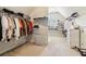 Spacious walk-in closet featuring custom shelving and ample storage for shoes and clothing at 2452 Stone Manor Ne Dr, Buford, GA 30519