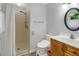 Neutral bathroom featuring a shower, toilet, vanity with sink, and an oval mirror at 3196 Windfield Cir, Tucker, GA 30084