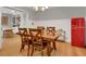 Elegant dining room with hardwood floors, dining table, and a vintage refrigerator at 3196 Windfield Cir, Tucker, GA 30084