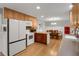 Open kitchen with ample counter space, modern appliances, and adjacent dining area at 3196 Windfield Cir, Tucker, GA 30084