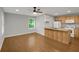 Kitchen with wood cabinets, laminate countertops, white appliances, hardwood floor and natural light at 3196 Windfield Cir, Tucker, GA 30084