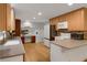 Well-lit kitchen with stainless steel appliances, light wood cabinets, and modern countertops at 3196 Windfield Cir, Tucker, GA 30084