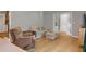 Cozy living room with hardwood floors, comfortable seating, and neutral decor at 3196 Windfield Cir, Tucker, GA 30084