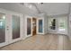 Bright sun room features tile floors, multiple doors leading outside, and access to the kitchen at 3196 Windfield Cir, Tucker, GA 30084