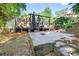 Spacious backyard features a beautiful stone patio and large wooden deck, perfect for outdoor entertaining at 6077 Lake Lanier Heights Rd, Buford, GA 30518
