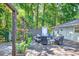 Lovely backyard deck with cozy seating arrangements and lush greenery, offering a serene outdoor living space at 6077 Lake Lanier Heights Rd, Buford, GA 30518