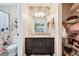 Well-lit bathroom with patterned wallpaper, closet access and granite countertop at 6077 Lake Lanier Heights Rd, Buford, GA 30518