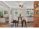 Eat-in kitchen with granite counters, white cabinets, and bar stool seating at 6077 Lake Lanier Heights Rd, Buford, GA 30518