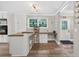 Bright eat-in kitchen features stainless appliances, ample cabinets, and a built-in desk area at 6077 Lake Lanier Heights Rd, Buford, GA 30518