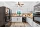 Updated kitchen with white cabinets, stainless steel appliances, and a functional layout for cooking at 6077 Lake Lanier Heights Rd, Buford, GA 30518