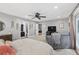 Expansive main bedroom boasts sitting area, natural light, and ensuite access at 6077 Lake Lanier Heights Rd, Buford, GA 30518