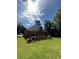 Spacious backyard with wooden deck and green lawn, perfect for outdoor activities at 709 Stonehenge Pl, Jonesboro, GA 30236