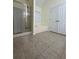 Well-lit bathroom featuring a stand-up shower and separate tub at 709 Stonehenge Pl, Jonesboro, GA 30236