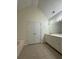 Full bathroom with a vanity and large mirror at 709 Stonehenge Pl, Jonesboro, GA 30236