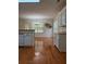 Dining room with hardwood floors and backyard views through window at 709 Stonehenge Pl, Jonesboro, GA 30236
