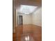 Bright dining room with hardwood floors, a modern chandelier, and detailed trim at 709 Stonehenge Pl, Jonesboro, GA 30236