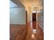 Inviting home entryway featuring gleaming hardwood floors, a stylish chandelier, and a welcoming view of the front door at 709 Stonehenge Pl, Jonesboro, GA 30236