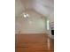 Expansive living room showcases gleaming hardwood floors, high ceilings, a charming fireplace, and an artistic tree design on the wall at 709 Stonehenge Pl, Jonesboro, GA 30236