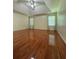 Spacious primary bedroom featuring hardwood floors, a ceiling fan, and recessed lighting at 709 Stonehenge Pl, Jonesboro, GA 30236