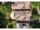 A top down aerial view of the home showing the roof, backyard, driveway, and surrounding trees and homes at 127 Oak Ln, Decatur, GA 30030