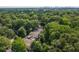 A neighborhood aerial view with green trees, city skyline in the distance at 127 Oak Ln, Decatur, GA 30030