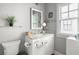 Bathroom featuring a granite countertop, vanity with ample storage, and decorative mirror at 127 Oak Ln, Decatur, GA 30030