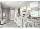 Spacious bathroom with dual vanities, marble countertops, and contemporary lighting at 127 Oak Ln, Decatur, GA 30030