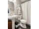 Bathroom with pedestal sink, white tile and shower curtain at 127 Oak Ln, Decatur, GA 30030