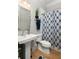 Classic bathroom with pedestal sink and patterned shower curtain at 127 Oak Ln, Decatur, GA 30030