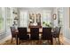 Elegant dining room featuring windows with shutters and a stylish chandelier at 127 Oak Ln, Decatur, GA 30030