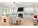 Bright living room with hardwood floors, fireplace, built-in shelving, and neutral decor at 127 Oak Ln, Decatur, GA 30030