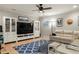 Cozy living room featuring comfortable seating, built-in cabinets, and a large television at 127 Oak Ln, Decatur, GA 30030