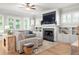 Bright living room featuring a fireplace, built-in shelving, and hardwood floors at 127 Oak Ln, Decatur, GA 30030