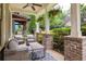 Cozy porch with brick pillars, comfy seating, and a view of the neighborhood at 127 Oak Ln, Decatur, GA 30030