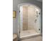 Luxurious walk-in shower with marble tile, glass enclosure, and rainfall showerhead at 127 Oak Ln, Decatur, GA 30030