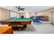 Finished basement with a pool table, seating area, and large projector screen for entertainment at 340 Helens Manor Dr, Lawrenceville, GA 30045